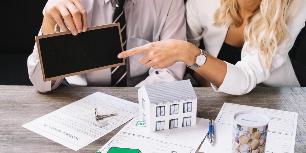 woman-pointing-chalkboard-estate-agency